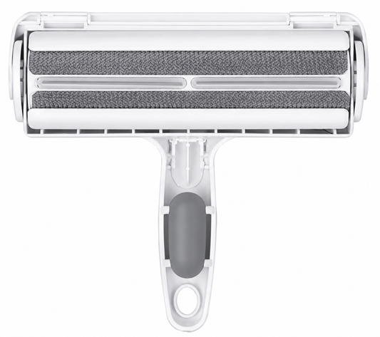 Clear plastic pet hair remover tool with gray roller and handle on white