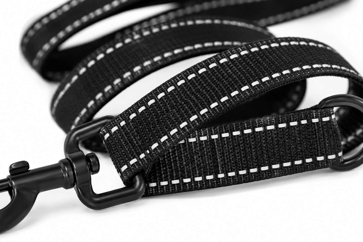 Close-up view of a sturdy black dog leash with reflective stitching and metal